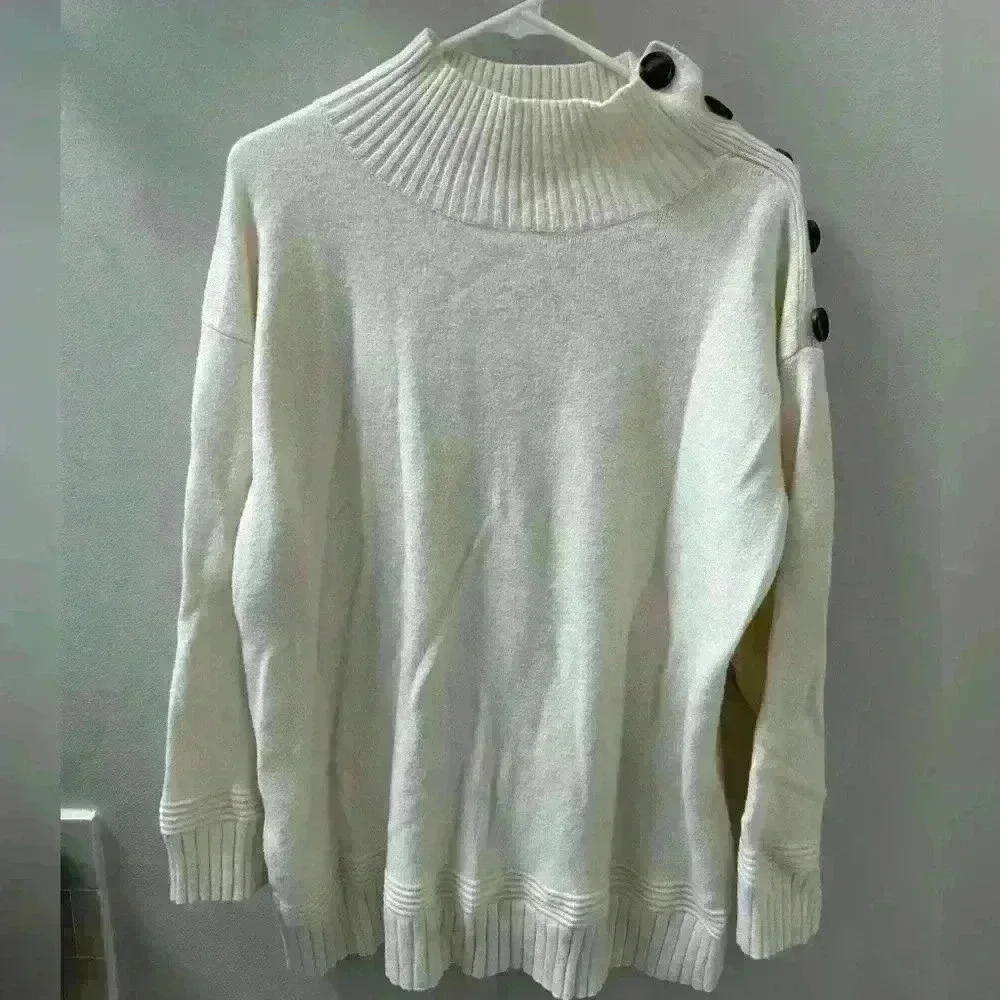 Woman's anthropology sweater size large. Cream color with open button neck line